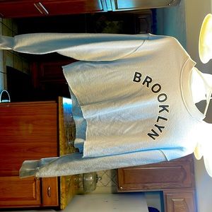 Blue crop sweater with Brooklyn on front from forever 21